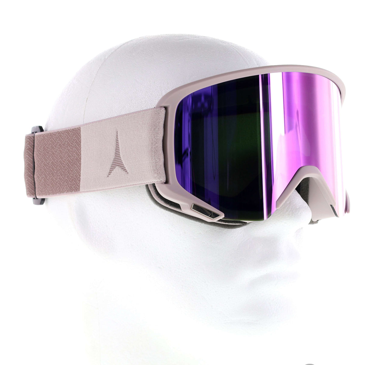 A pair of ski goggles with a matte taupe strap and frame, featuring a large purple mirrored lens, displayed on a white mannequin head against a white background.