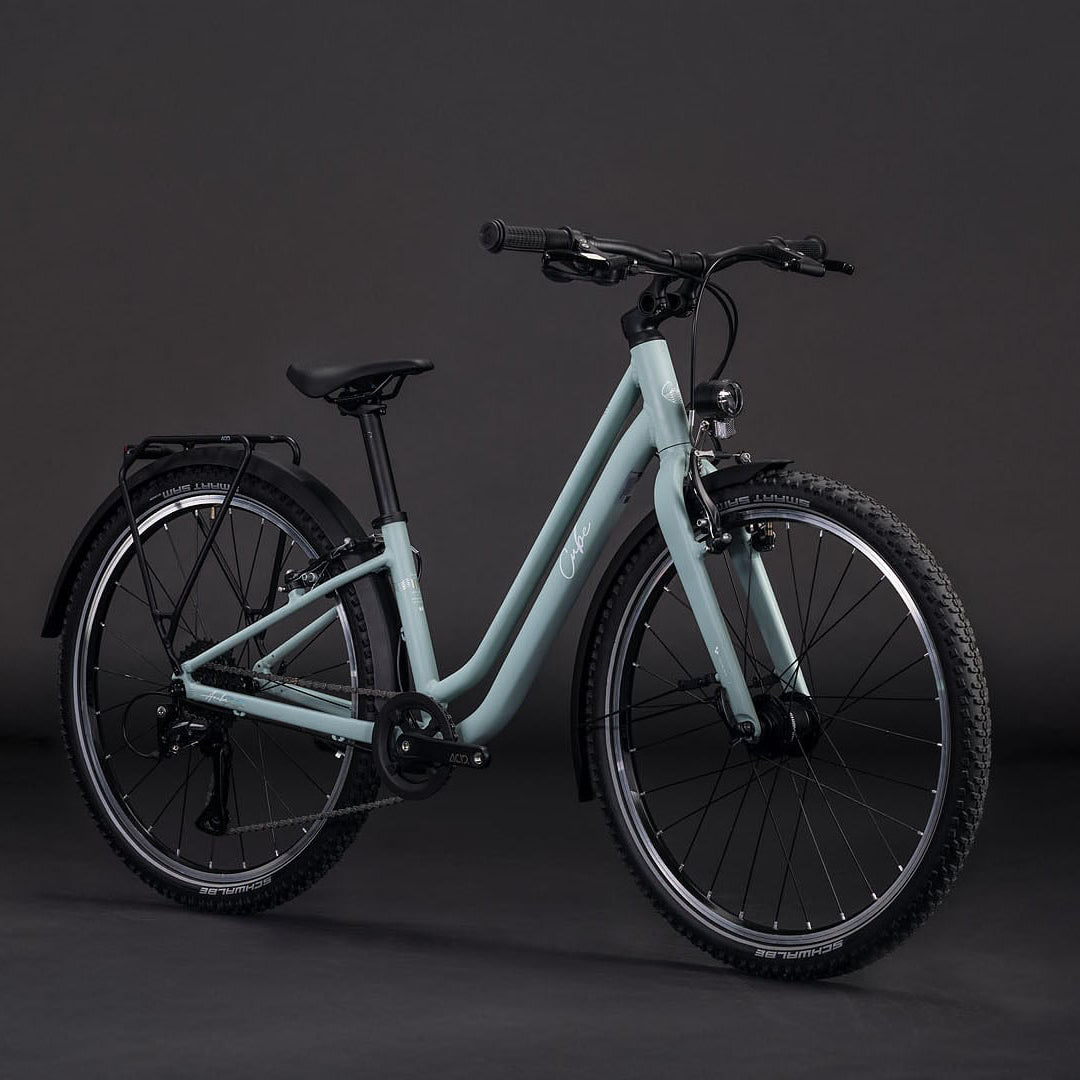 Light blue bicycle on a dark gray background