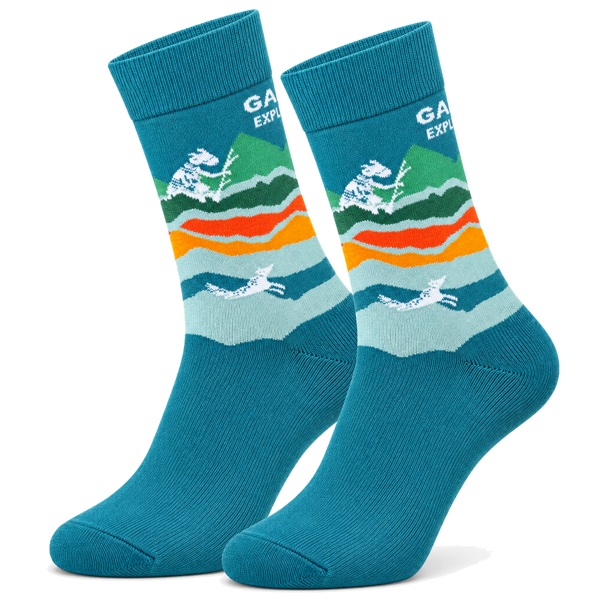 A pair of teal crew socks with a colorful graphic design featuring white bison, green mountains, and orange and red wavy stripes, shown on a white background.