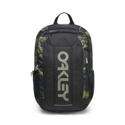Oakley backpack in black with green and brown camouflage pattern side panels and a large vertical Oakley logo on the front.