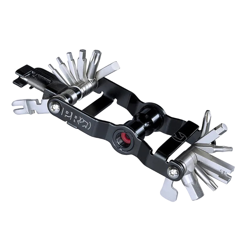 A black and silver multi-tool bicycle chainstay tool with various flathead screwdriver bits extended, shown on a plain white background.