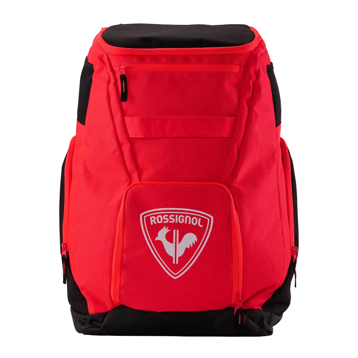 A red and black Rossignol sports backpack with multiple zippered pockets and a white team crest on the front pocket, shown against a light gray studio background.