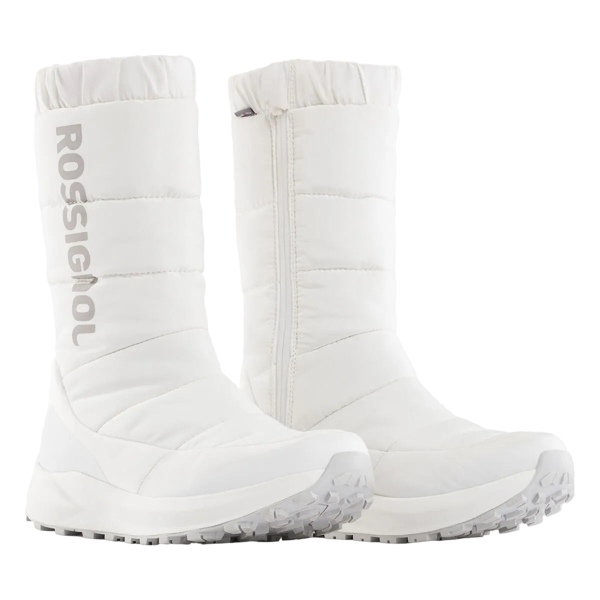 A pair of white Rossignol mid-calf winter boots with a quilted puffer design, side zippers, and rugged soles, shown against a light gray studio background.