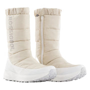Pair of beige winter boots with white soles on a light gray background