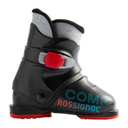A Rossignol Comp ski boot in black with red and light blue accents, shown in a side profile on a light gray background.