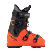 A Rossignol EVO Max ski boot in bright orange and black, shown from a side profile view against a light gray background.