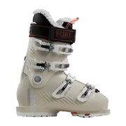 A Messhol Pure ski boot in a light beige colorway, featuring white buckles, a black ankle strap with red stitching and branding, and a white fleece lining.