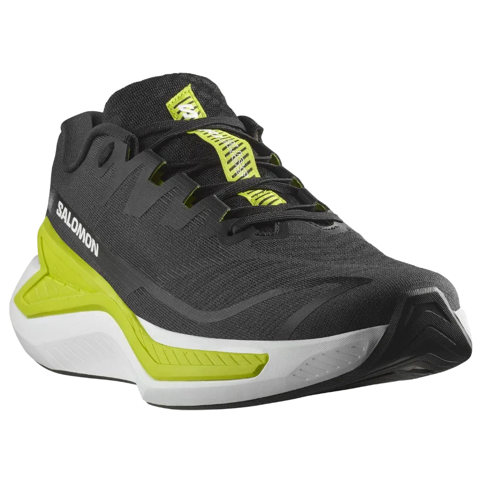 Black and green Salomon running shoe on a white background