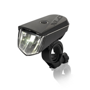 A black bicycle tail light with a clear front lens and adjustable mounting clamp, shown on a white background with a faint reflection below.