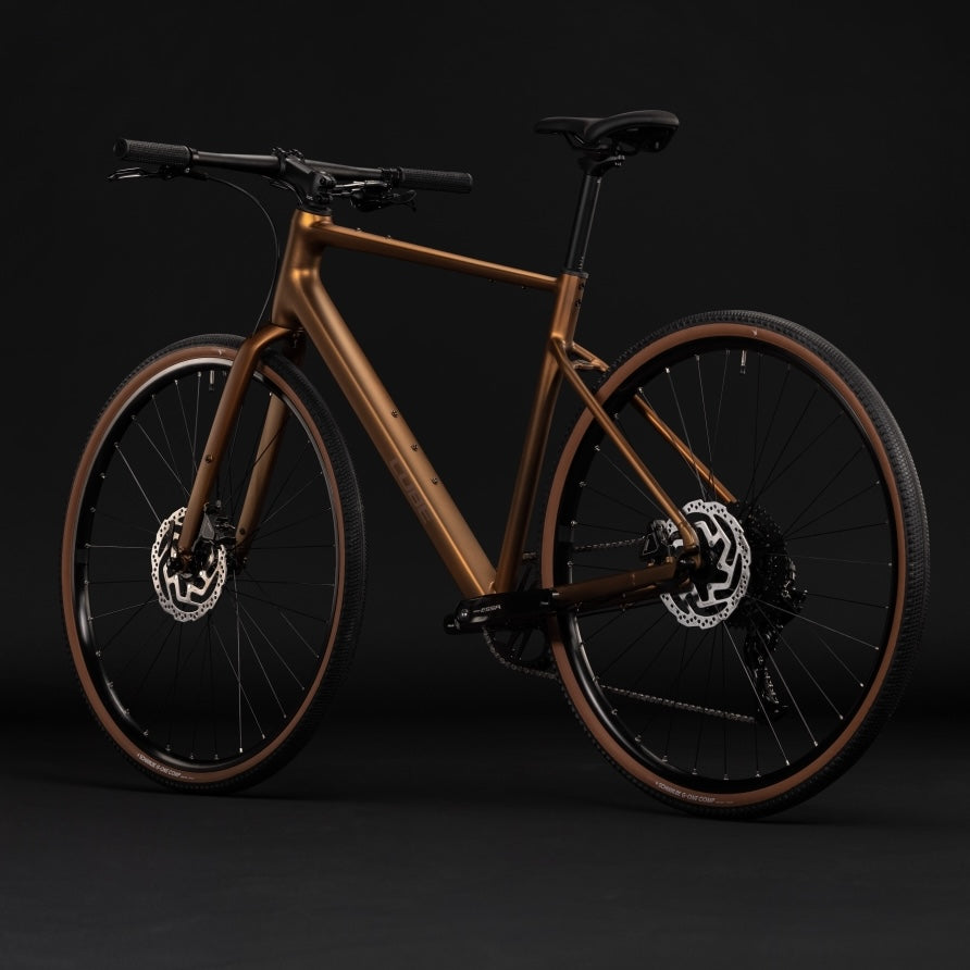 Bicicleta urbana CUBE NULANE ONE – Caramelo metálico / Marrón 2027
